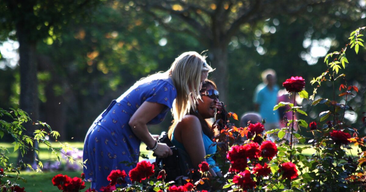 Two women surrounded by flowers at RHS Wisley